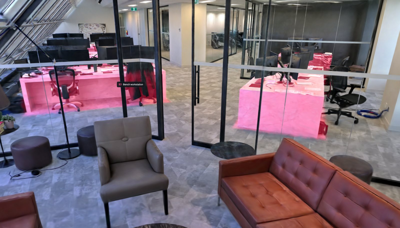 Office interior splat with desks highlighted in amber and monitors in blue